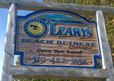 O'Leary's Beach Retreat Cottages Sign